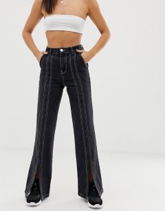 Черные расклешенные джинсы стандартной длины с белой строчкой и разрезами ASOS DESIGN-Черный